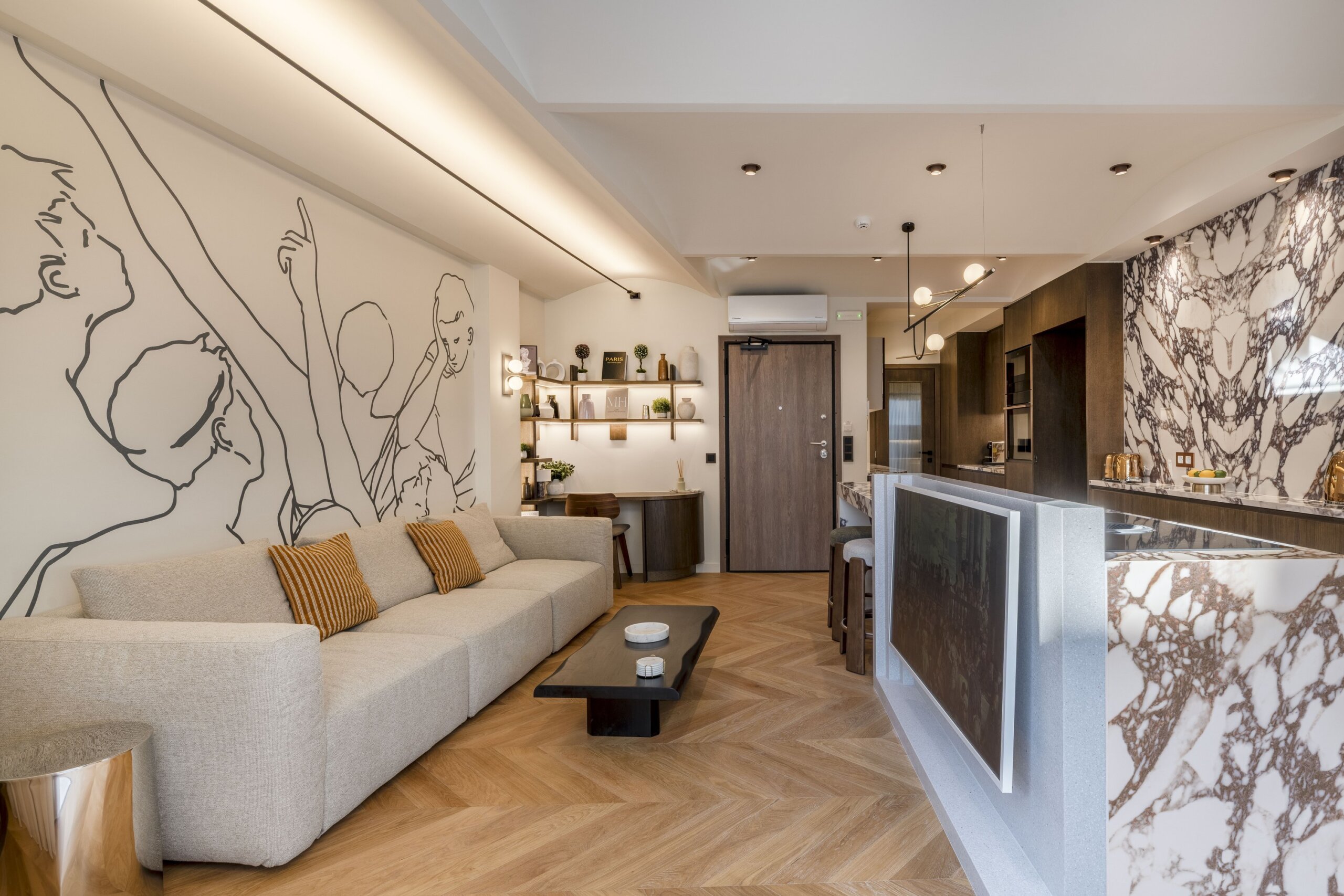 Open plan living room and fully equipped kitchen at Acropolis Luxury Penthouse in Koukaki, Athens
