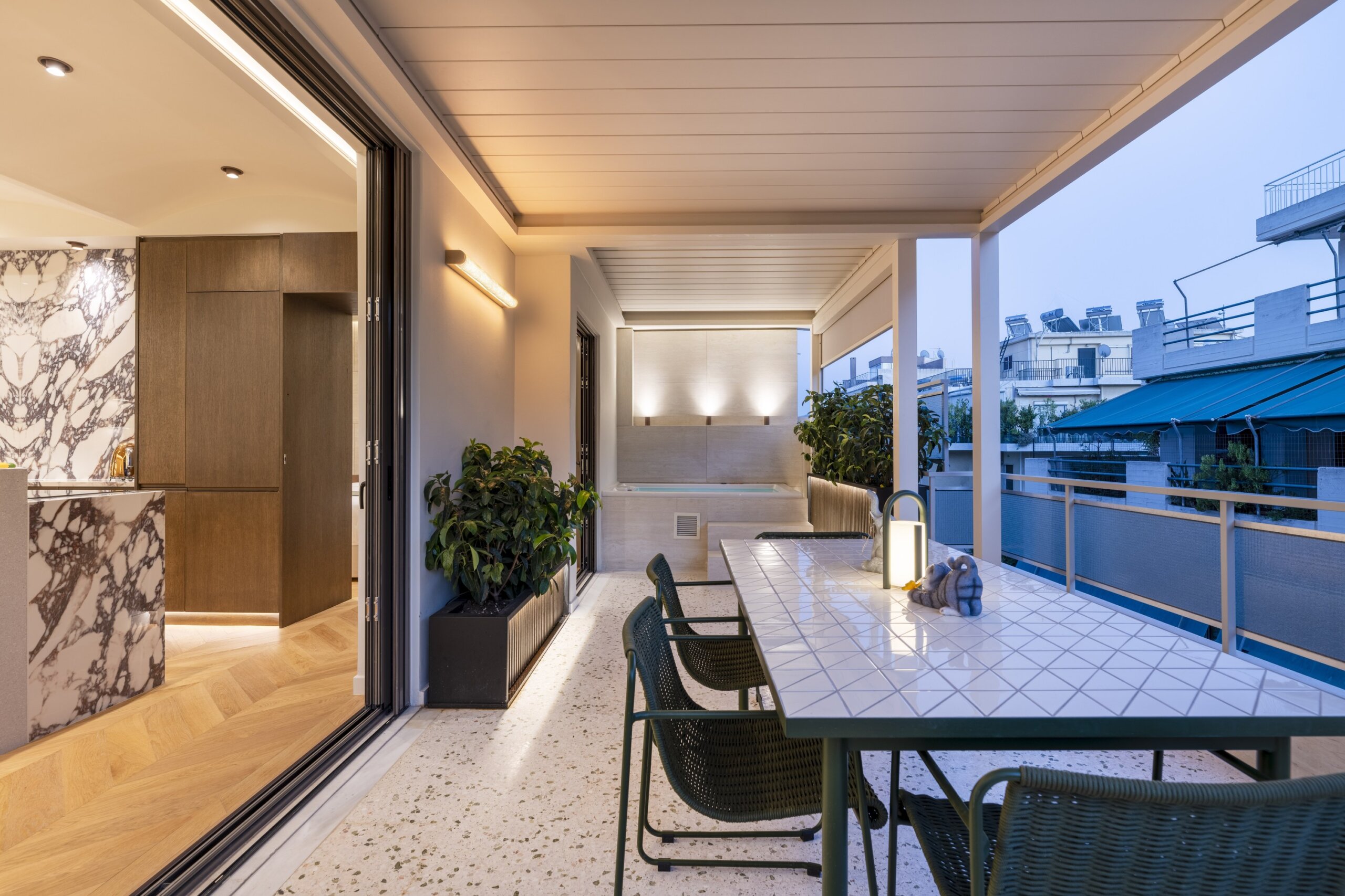 Private balcony with outdoor hot tub at Acropolis Luxury Penthouse in Koukaki, Athens