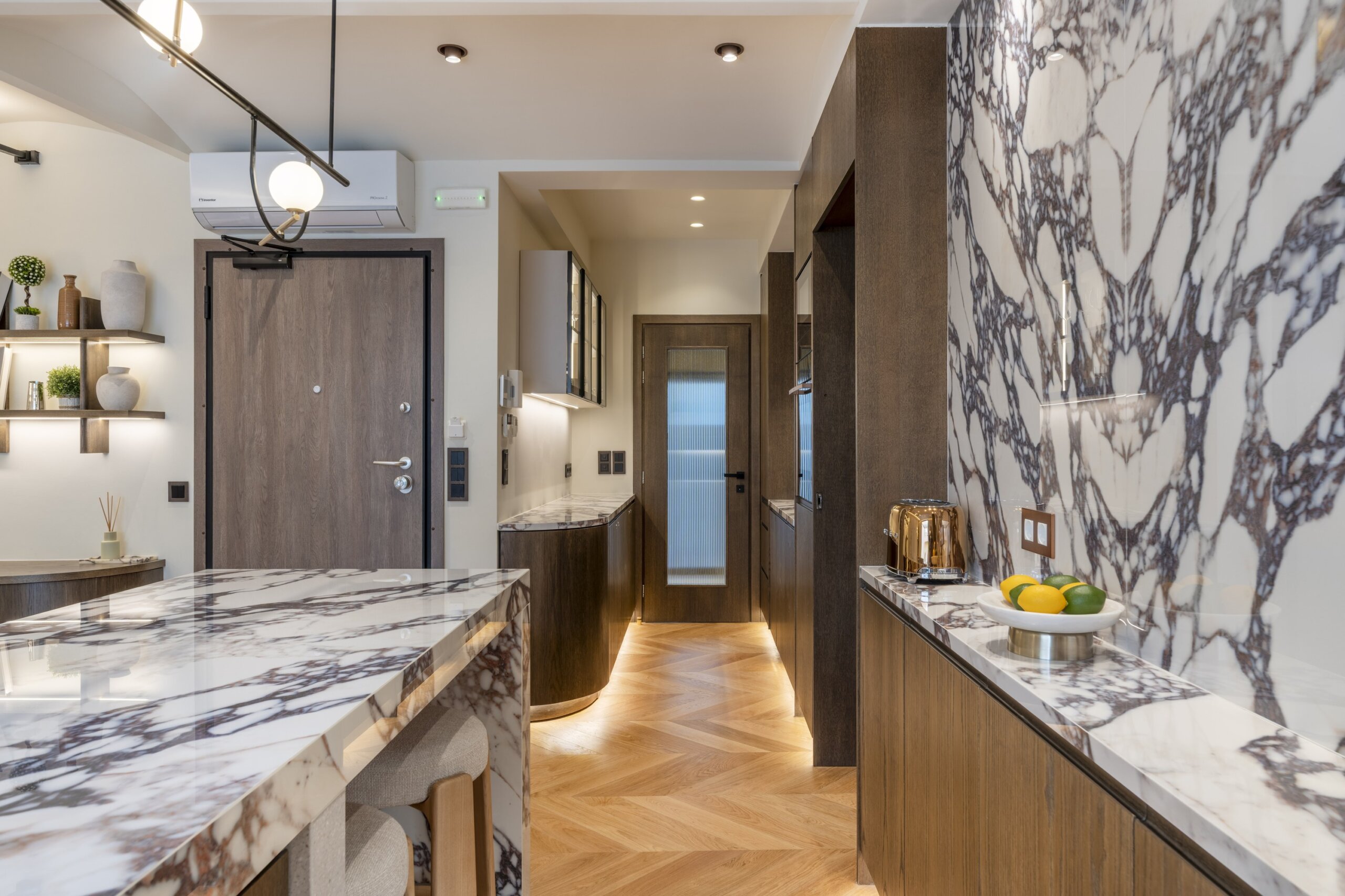 Open plan living room and fully equipped kitchen at Acropolis Luxury Penthouse in Koukaki, Athens