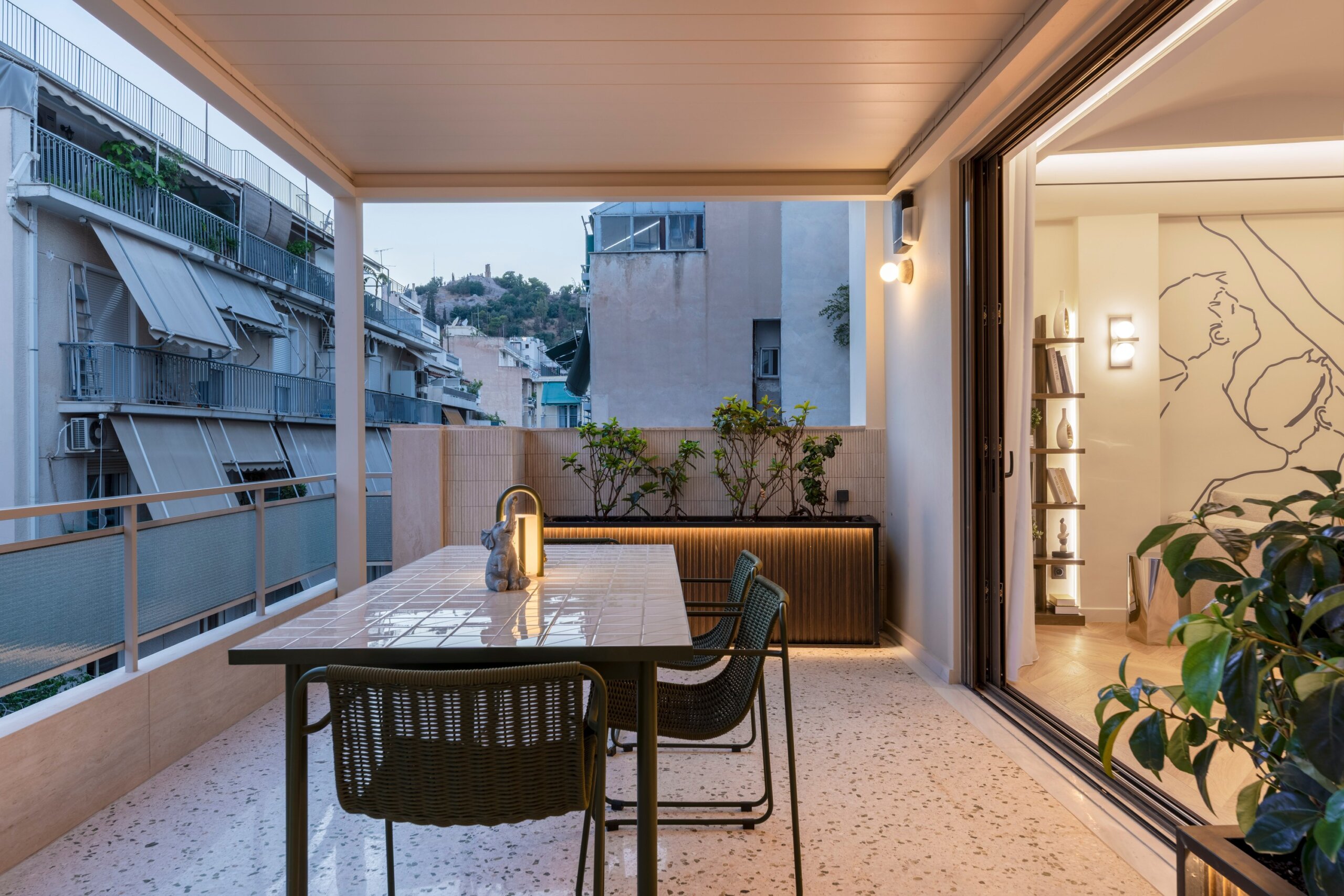 Private balcony with outdoor hot tub at Acropolis Luxury Penthouse in Koukaki, Athens