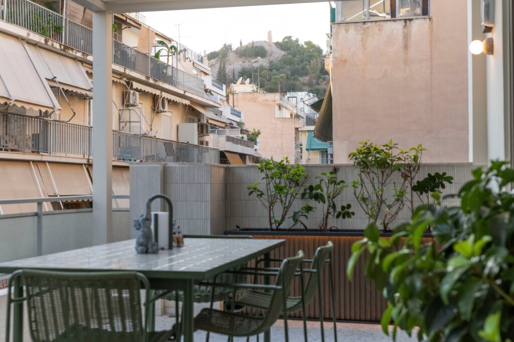 Private balcony with outdoor hot tub at Acropolis Luxury Penthouse in Koukaki, Athens