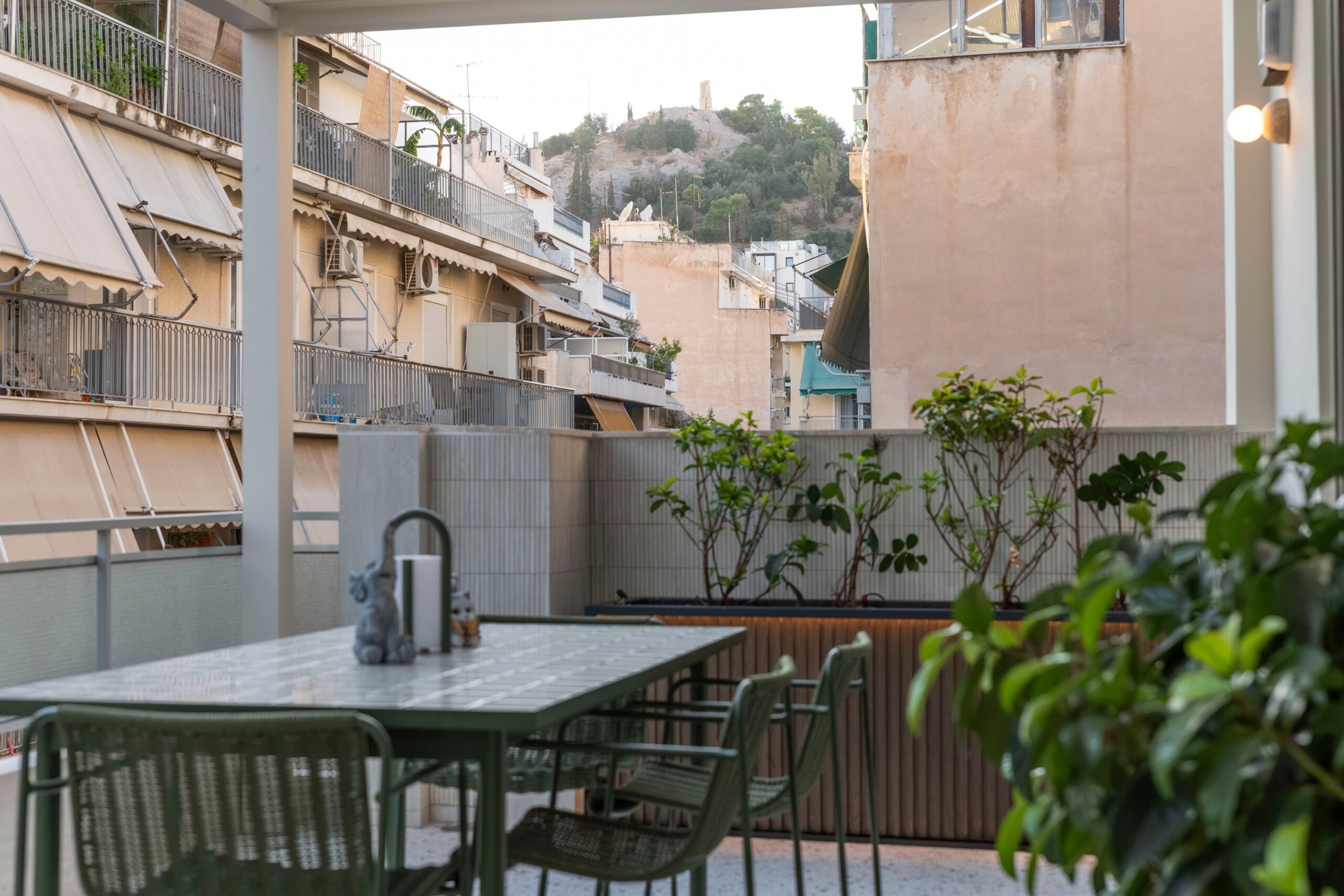 Private balcony with outdoor hot tub at Acropolis Luxury Penthouse in Koukaki, Athens