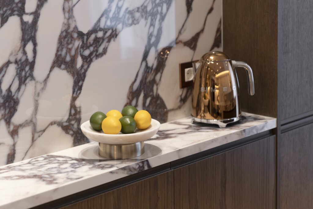 Open plan living room and fully equipped kitchen at Acropolis Luxury Penthouse in Koukaki, Athens